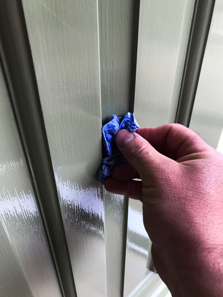 Cleaning out cracks around door panels