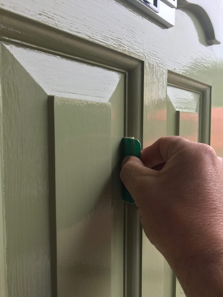 Sanding cracks around door panels