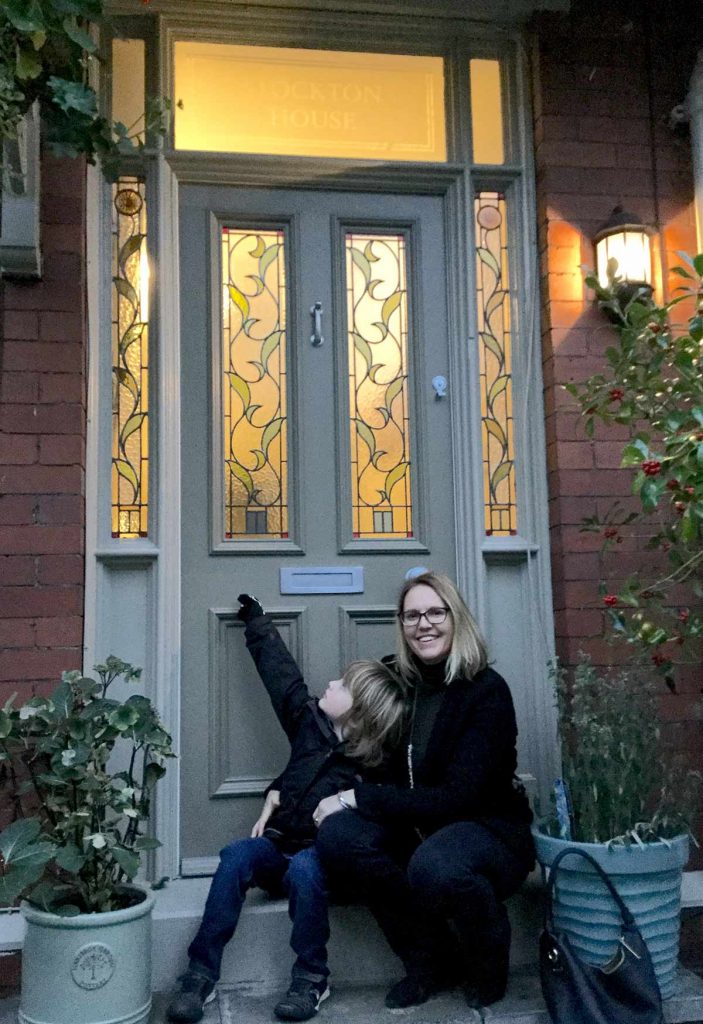 Claire with her Grand Victorian hardwood front door
