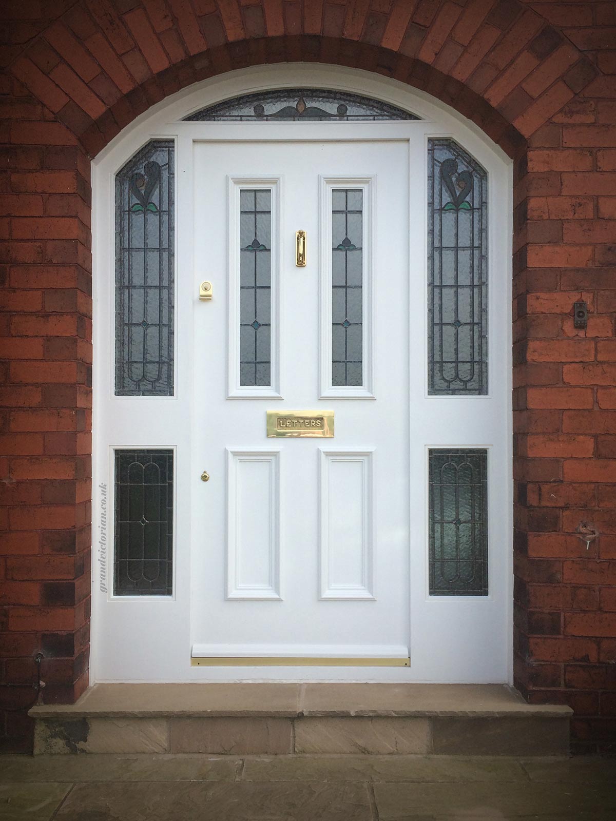 Grand Victorian front door and arched frame